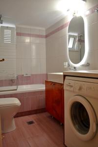 a bathroom with a washing machine and a sink at Melina's House in Stalos +76 photos