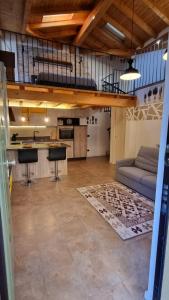 a large living room with a couch and a kitchen at Casa del Cedro - Comfort e relax in Legnano