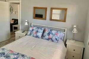 A bed or beds in a room at Gorgeous Beach view balcony with heated pool