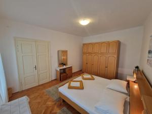 Posteľ alebo postele v izbe v ubytovaní Apartments and Rooms Mazuranic