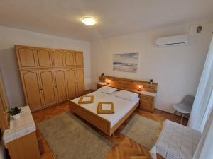 Posteľ alebo postele v izbe v ubytovaní Apartments and Rooms Mazuranic