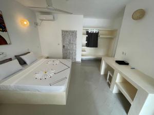Watamu Ascot Resort客房内的一张或多张床位