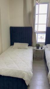 Postel nebo postele na pokoji v ubytování Flat in Maabela