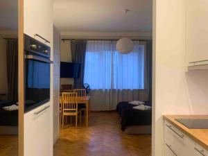a living room with a kitchen and a dining room at Great place to stay in Warsaw in Warsaw