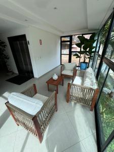 a living room with two couches and a table at Maraca Beach in Porto De Galinhas