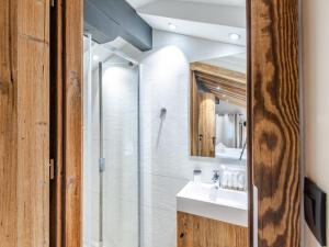 a bathroom with a glass shower and a sink at Appartement Morzine, 4 pièces, 8 personnes - FR-1-754-11 in Morzine