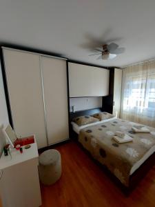 Postel nebo postele na pokoji v ubytování Apartments Gracia & Toni
