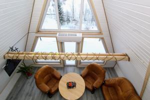 an overhead view of a room with a table and chairs at Cottage "A-FRAME romantic house" in Yaremche