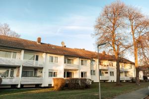 an apartment building with white balconies and a street light at Ferienwohnung in Kassel