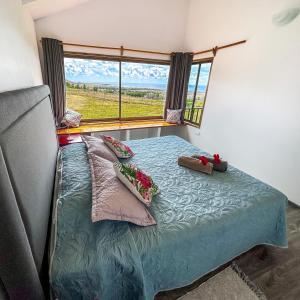 Postel nebo postele na pokoji v ubytování Maunga Roa Eco Lodge