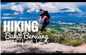a man is standing on top of a mountain at IDAMAN HOMESTAY in Jasin