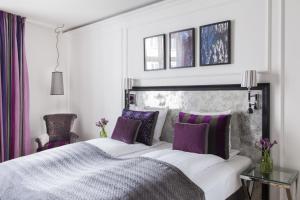 Postel nebo postele na pokoji v ubytování Absalon Hotel