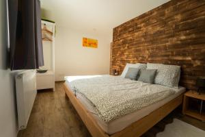 A bed or beds in a room at Haus Faninger - Summercard included