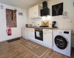 A kitchen or kitchenette at Haus Faninger - Summercard included