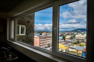 a window with a view of a city at Ushuaia Center Apartament Suit in Ushuaia