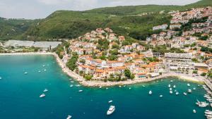 an aerial view of a town with boats in the water at AMBER in Rabac
