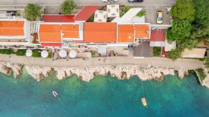 an aerial view of a resort and the ocean at AMBER in Rabac +2 photos