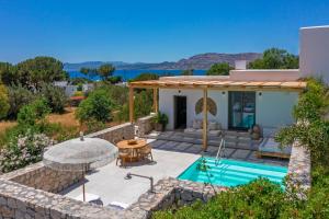 an image of a villa with a swimming pool at Milos Villas Complex in Pefki Rhodes