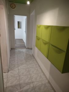 a hallway with green panels on a wall at Viridis in Rijeka