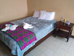 A bed or beds in a room at Hotel Tahami
