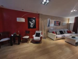 a living room with a couch and a table at La Casa del Bosque in El Bosque +22 photos