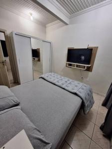 A bed or beds in a room at Apartamento excelente localização em Manaus
