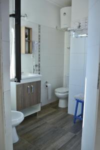 a bathroom with a sink and a toilet at Posada Santa Rita in Colonia del Sacramento