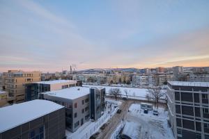 a view of a city with snow covered buildings at Alessandro Home 11 Luxury Centru Palas Mall Iași Q Residence in Iaşi