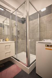 a bathroom with a shower and a sink at Alessandro Home 11 Luxury Centru Palas Mall Iași Q Residence in Iaşi