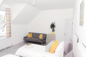 a living room with a couch and a chair at Inviting 3-Bed Apartment in Bromley in Bromley