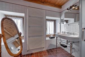 a bathroom with a sink and a mirror at Chalet BRAGARD in Limone Piemonte +160 photos