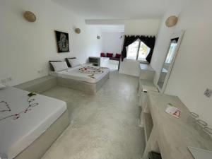 Watamu Ascot Resort客房内的一张或多张床位