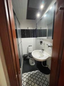 a bathroom with a sink and a toilet at Hostel Movistar Arena in Bogotá
