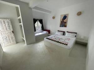 Watamu Ascot Resort客房内的一张或多张床位