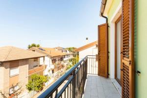 a balcony with a view of some buildings at Casa Lilly in Porto SantʼElpidio