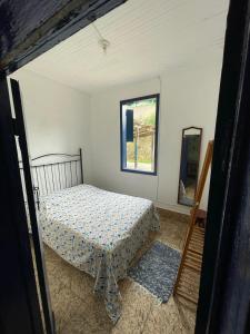 Een bed of bedden in een kamer bij Casa Vila 20 - Casa para temporada em Miguel Pereira