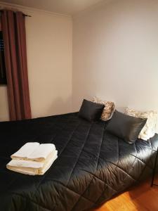 A bed or beds in a room at Casa da Escola