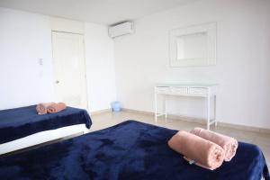 Ένα ή περισσότερα κρεβάτια σε δωμάτιο στο Lindo loft en playa Marlin, 2 min de Plaza la Isla - Mar310 -