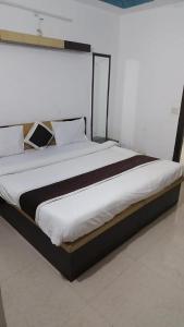 Voodi või voodid majutusasutuse Hotel Blossom Family Rooms toas