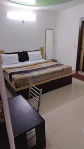 Ein Bett oder Betten in einem Zimmer der Unterkunft Hotel Blossom Family Rooms