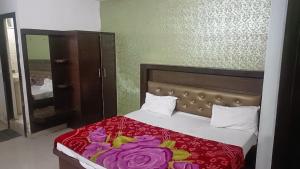 Katil atau katil-katil dalam bilik di Hotel Blossom Family Rooms