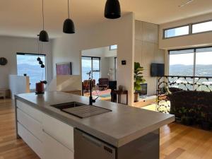 a kitchen and living room with a counter top at Fusion House in Tranmere