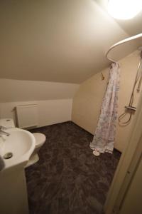 a small bathroom with a sink and a toilet at House close to the Sea in Sundsvall