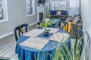 a dining room table with a blue table cloth at Brick Beauty Fayetteville 3 bedroom Mins from Downtown in Fayetteville