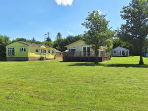 a group of houses in a field of grass at Hazel in Thornbury