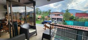 a balcony with a view of a house at Alojamientos N&S in Fortuna