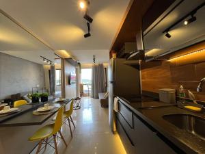 a kitchen with a sink and a counter top at Lake Side Reformado Lago Paranoá Brasília DF in Brasilia