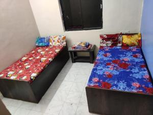 Letto o letti in una camera di sri rama krishna pg