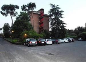 a group of cars parked in a parking lot at Sweet RHome - A due passi da San Pietro in Rome