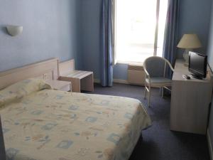 Posteľ alebo postele v izbe v ubytovaní Le Central
